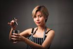 portrait-young-woman-asian-barista-coffee-cafe-worker-concept aurora coffee